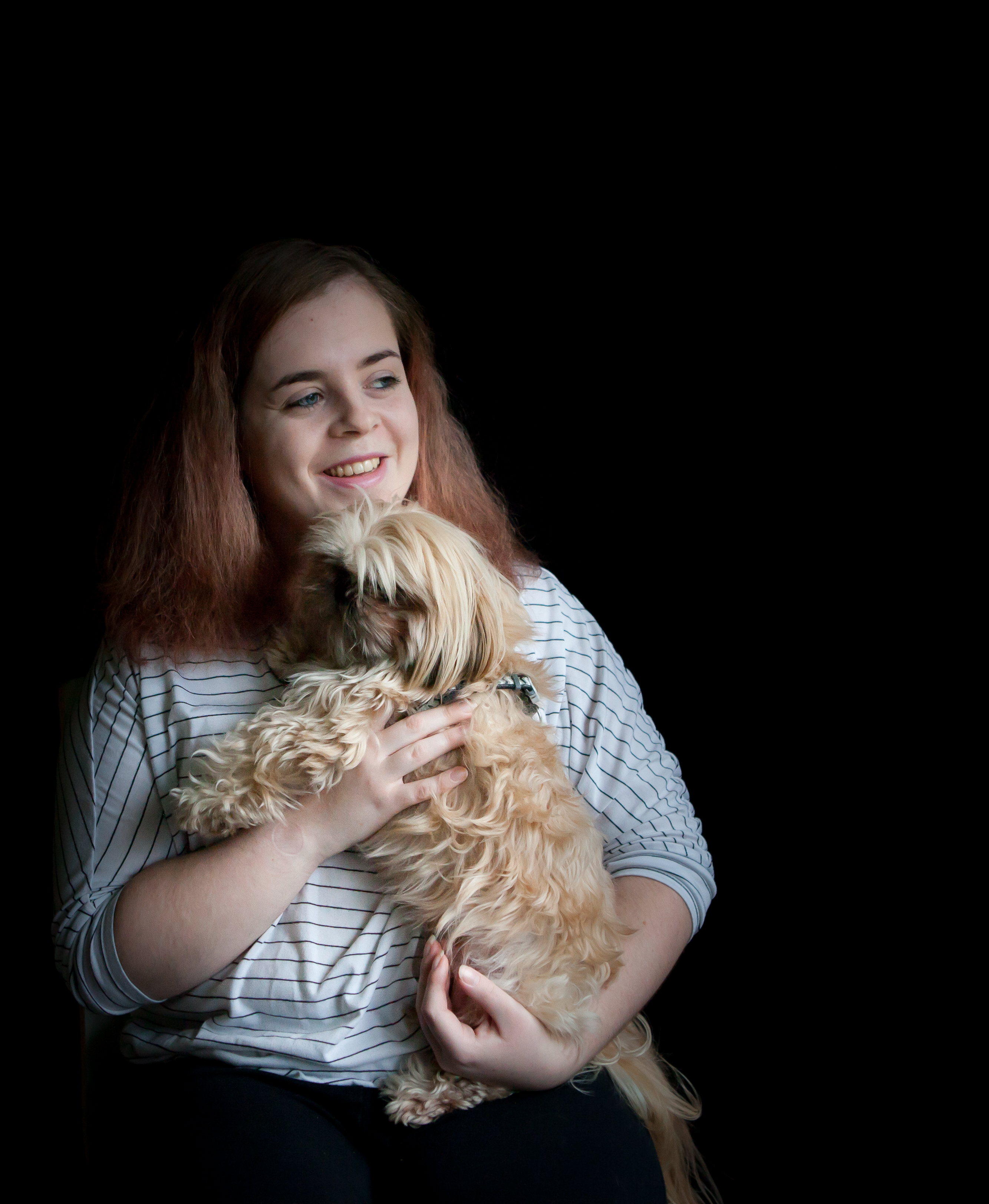Rebecca, brain injury survivor, holding her dog