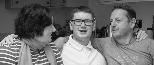 A brain injury survivor with his family